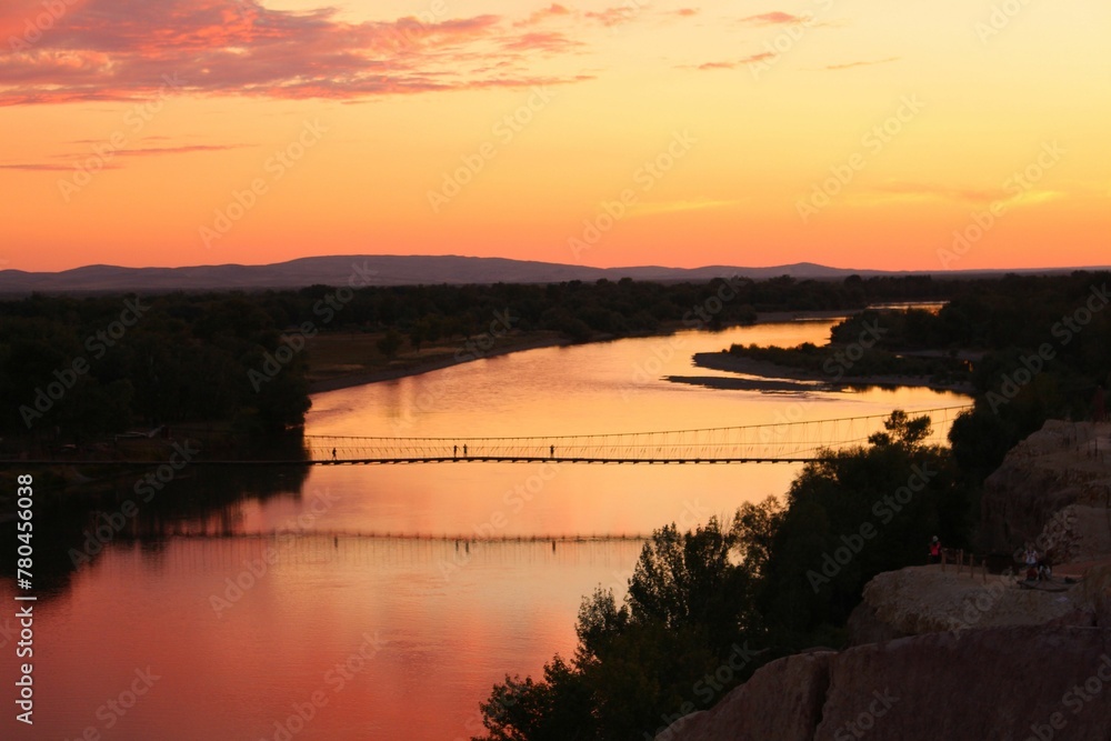 Mesmerizing sunset view over the river and a bridge