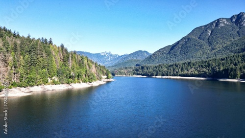 Beautiful view of Capilano Lake near the mountains in British Columbia  Canada