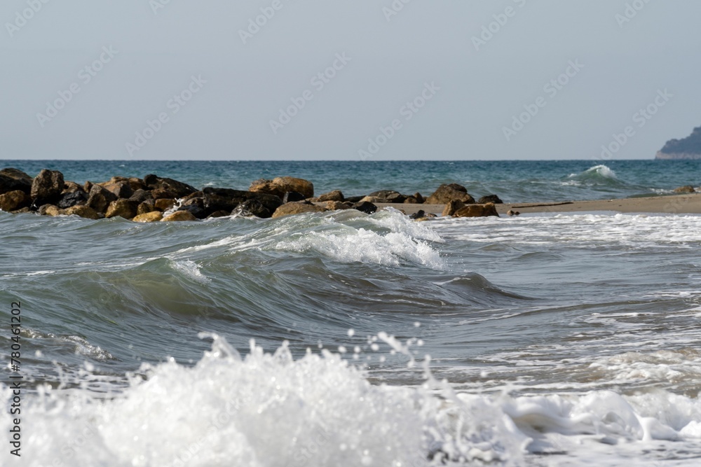 Foamy waves splashing a shore line, beautiful seascape Foamy waves splashing a shore line, beautiful seascape
