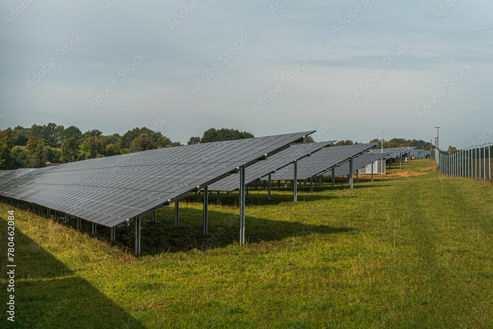 Solar system panels in the large photovoltaic power plant in the green field