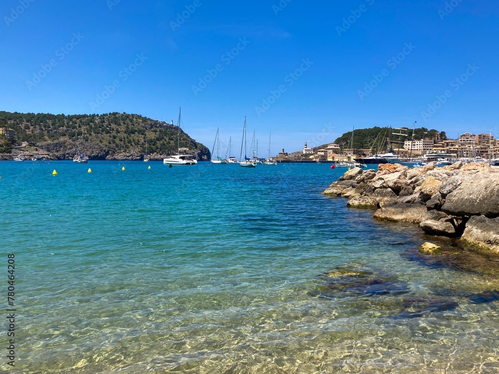 Rocky coast and blue freshwater in a port in the Balearic Islands, Mallorca, Spain