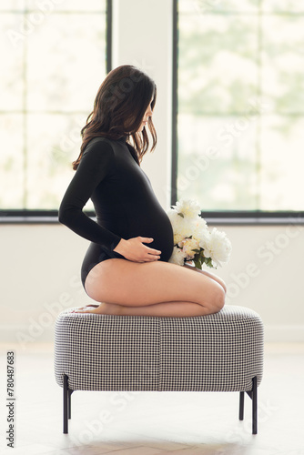 Pregnant woman sitting on chair