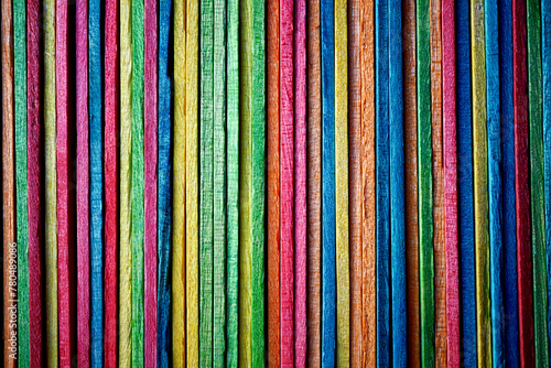 Multi colored wooden craft sticks, colorful background