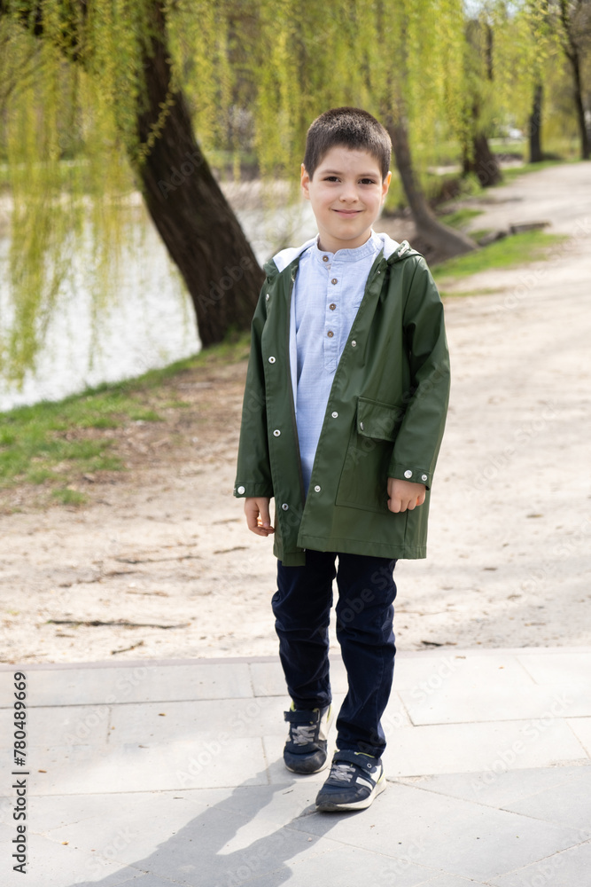 Six-year-old boy walking in spring park. Six-year-old boy walking in spring park.