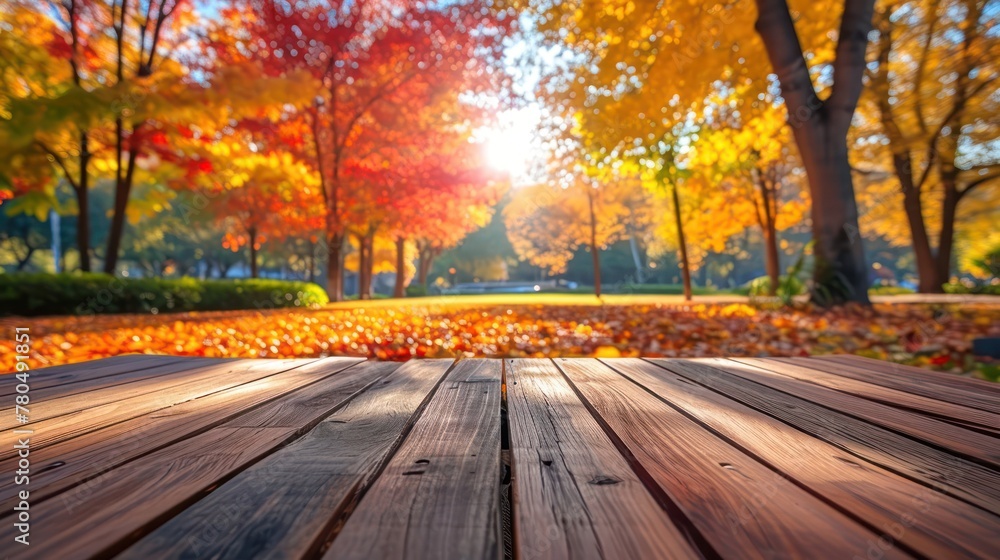 Beautiful colorful natural autumn background. Wooden flooring on the background of a blurred autumn park