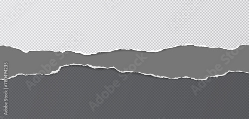 Black and grey paper with torn edges and soft shadow are on squared background for text.