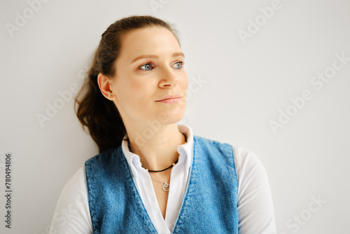 Closeup portrait of pensive woman looking to the side