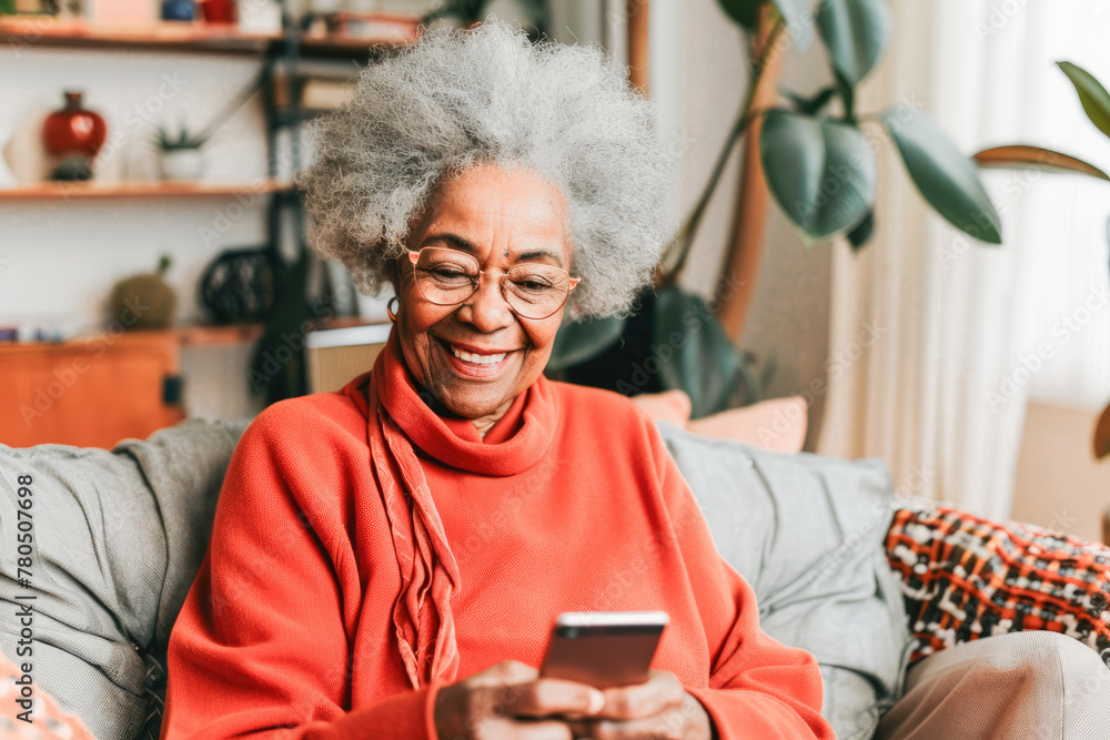 Portrait of a relaxed senior woman smiling using her smartphone at home. Modern lifestyle of the elderly people. Portrait of a relaxed senior woman smiling using her smartphone at home. Modern lifestyle of the elderly people.