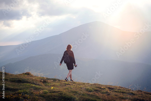 Young Girl in Black Outfit Walks in High Carpathian Mountains