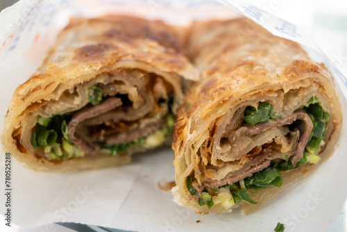 Taiwanese beef rolls - thinly sliced, braised beef, wrapped with sweet hoisin sauce in a crispy, flaky scallion pancake.