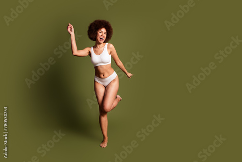 No retouch photo of pretty shiny lady underwear lingerie enjoying self acceptance empty space isolated khaki color background