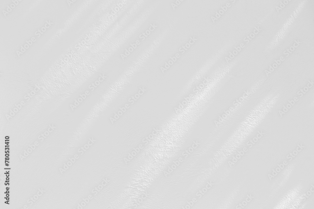 Obraz premium Blank white cement wall background, morning light shade on blank white wall background