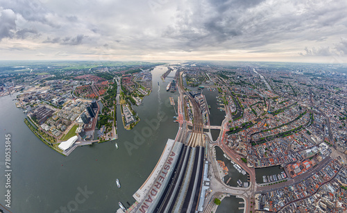 Amsterdam  Netherlands. Central Railway Station. Panorama of the city on a summer morning in cloudy weather. Aerial view