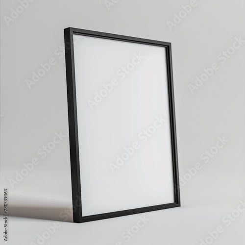 Minimalist black-framed picture frame with a blank white background on a neutral surface.