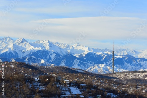 The winter view of the Almaty mountains taken from the surrounding hills photo