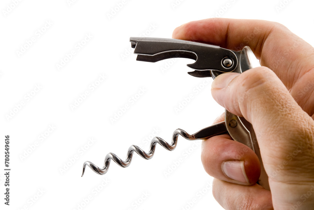 hand holding a corkscrew and bottle opener against a white background hand holding a corkscrew and bottle opener against a white background