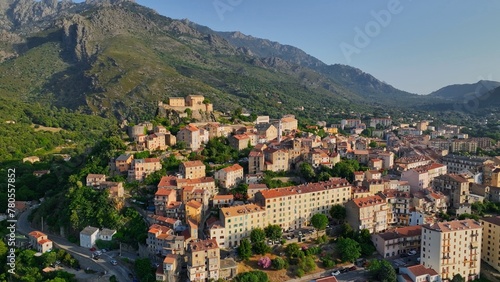 Aerial view of Corte old town, Corsica island. Morning shot of old houses on the hill in Corte village, Corsica, France © SJ Travel Footage