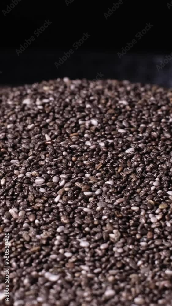 Slow motion of beautiful natural dried chia seeds rotating on a plate. Close-up of organic black and white Salvia Hispanica seeds. Superfood rich in Omega 3 fatty acids. Healthy lifestyle concept. Slow motion of beautiful natural dried chia seeds rotating on a plate. Close-up of organic black and white Salvia Hispanica seeds. Superfood rich in Omega 3 fatty acids. Healthy lifestyle concept.