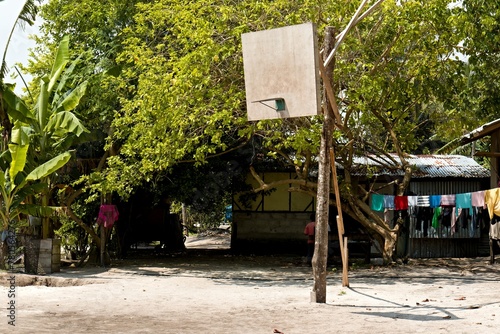 Village on Mabul Island, basketball court. Sabah. Malaysia.  photo