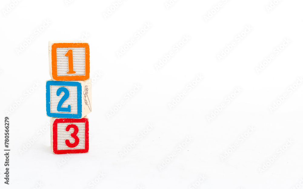 Educational wooden blocks with numbers isolated on white background. Number learning concept. Educational wooden blocks with numbers isolated on white background. Number learning concept.