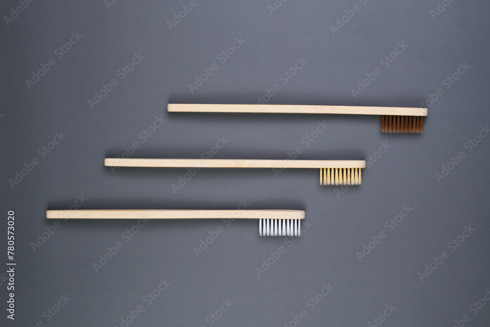 Three Wooden Combs on Gray Surface.Health Care, Stomatology banner Three Wooden Combs on Gray Surface.Health Care, Stomatology banner