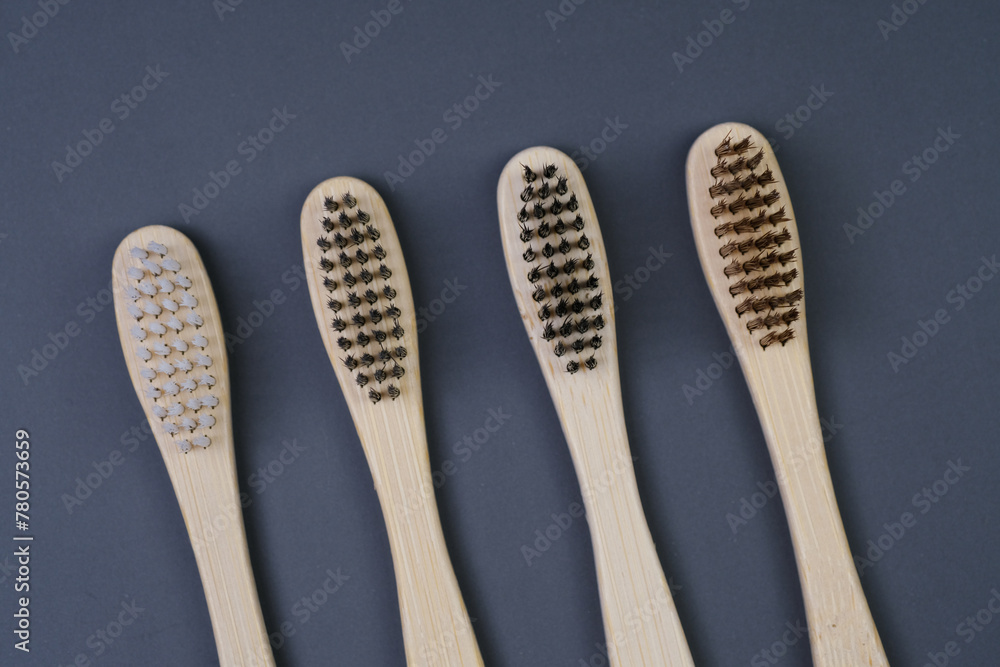 Toothbrushes on a grey backgorund. Eco-friendly toothbrushes..Health Care, Stomatology banner Toothbrushes on a grey backgorund. Eco-friendly toothbrushes..Health Care, Stomatology banner