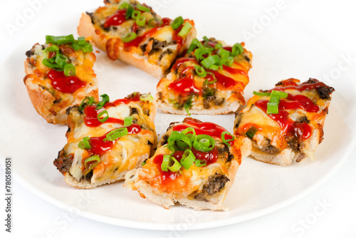 Toasted open-face sandwich made of a sliced baguette topped with white mushrooms, cheese and ketchup, zapiekanki