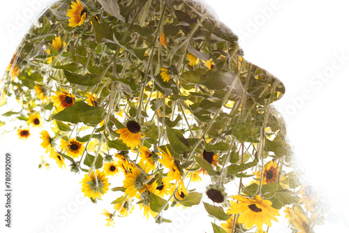 A double exposure profile of a man merged with yellow flowers photo