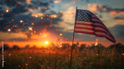 The American flag proudly flutters in the sunlit golden at sunset