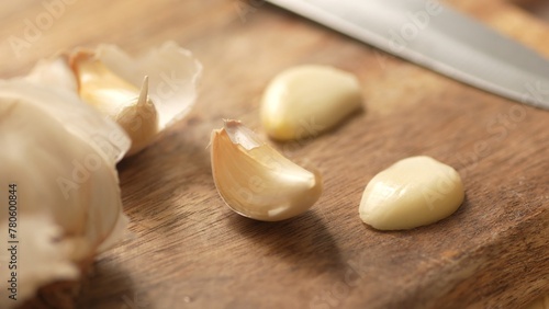 Garlic cloves on a cutting board. Close-up, shallow dof.