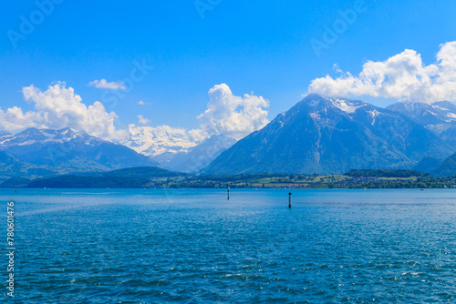 View of the Annecy lake surrounded by beautiful mountains in Annecy, France