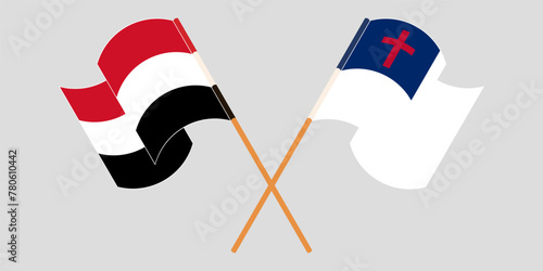 Crossed and waving flags of Yemen and christianity