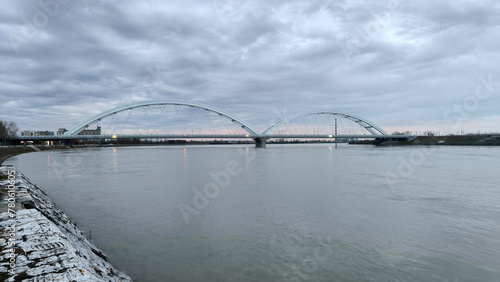 panoramic view of the bridge over Danube river in Novi sad, reflected in the water surface 