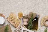 Flat lay composition with different cleaning supplies on beige background, space for text