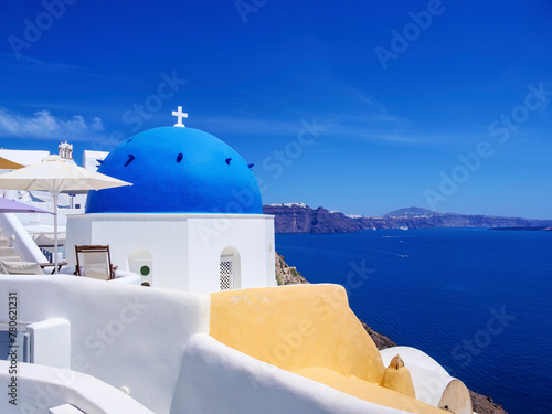 Iconic blue domed church of Saint Spyridon, Oia Village, Santorini (Thira) Island, Cyclades, Greek Islands photo