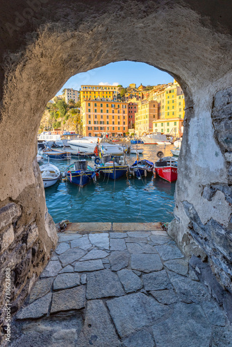 The beautiful harbour of Camogli seen through a house arch, Camogli, Genova province, Liguria, Italy photo