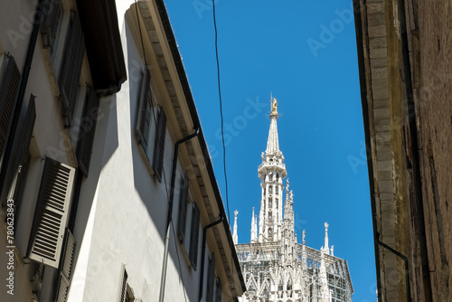 View of Milan Cathedral (Duomo di Milano), from one of the surrounding streets in the Piazza del Duomo (Cathedral Square), Milan, Lombary, Italy photo