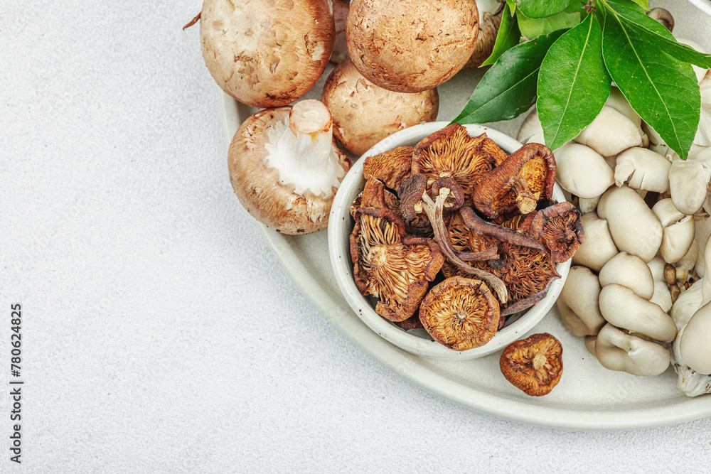 Assortment of various mushrooms - fresh, dried and pickled. Oyster, cremini, porcini and shiitake Assortment of various mushrooms - fresh, dried and pickled. Oyster, cremini, porcini and shiitake