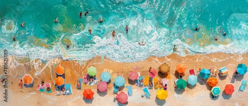 An aerial view of a colorful array of beach umbrellas and sun loungers lined up along the shoreline, with people sunbathing, swimming, and playing in the waves under a bright blue sky