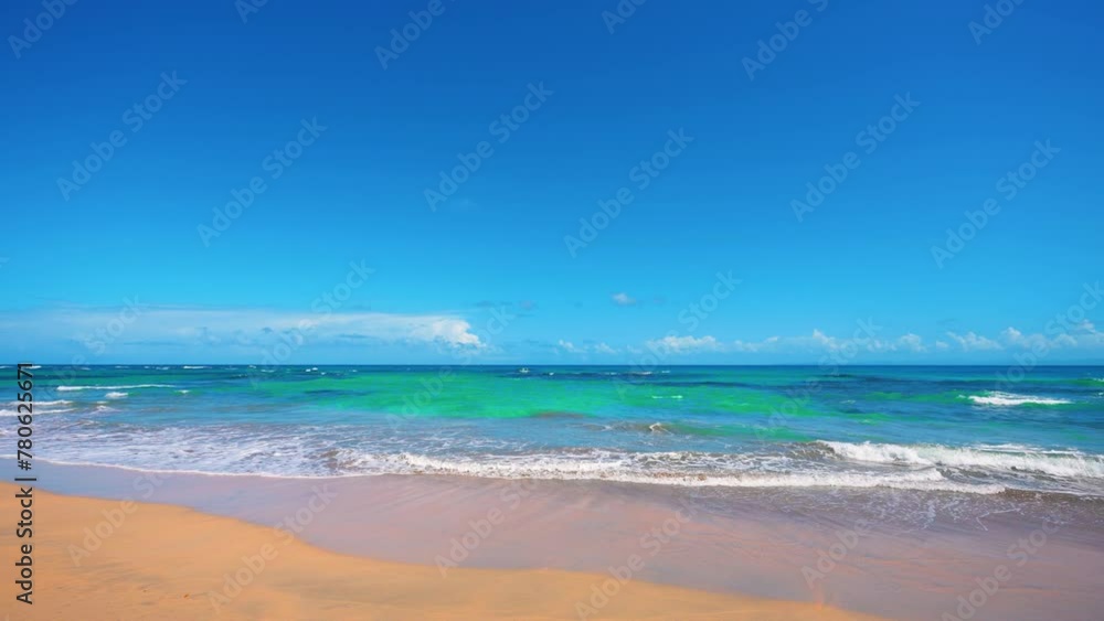 Background of summer wave of the Atlantic ocean on a sandy beach. Calm tropical sea against the morning sky. Summer tropical nature landscape. Cruise. Warm water for outdoor bathing. Background of summer wave of the Atlantic ocean on a sandy beach. Calm tropical sea against the morning sky. Summer tropical nature landscape. Cruise. Warm water for outdoor bathing.