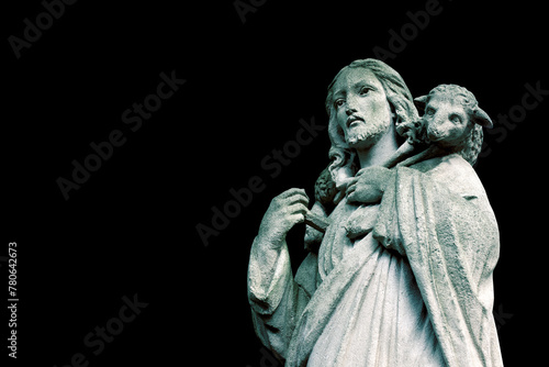Jesus Christ the Good Shepherd holds a lost sheep on his back © vlady1984