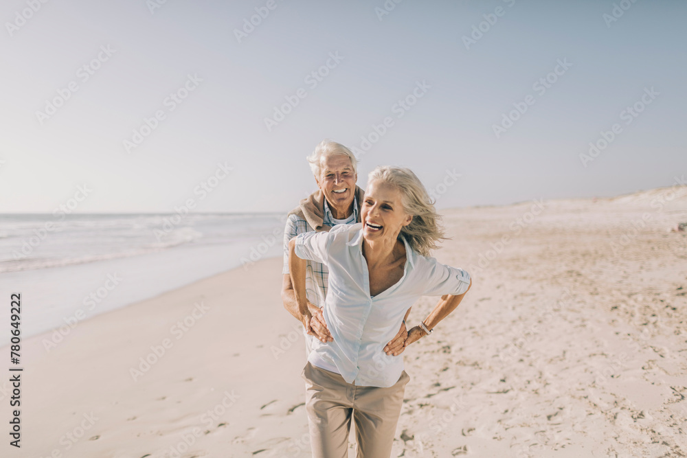 Senior couple in casual clothes embracing on the beach Senior couple in casual clothes embracing on the beach