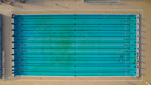 Olympic pool with two swimmers training and competing in Salvador, Bahia