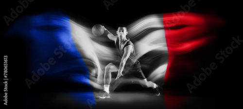 Fototapeta Naklejka Na Ścianę i Meble -  Monochrome image of man, basketball player during game in motion with ball on black background with flag of France element. Concept of professional sport, competition, tournament. Banner. Sport event
