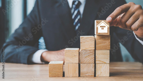 Wooden block stacking as step stair with businessman icon, Ladder of success in business growth concept
