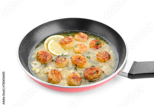 Delicious scallops with sauce in frying pan isolated on white