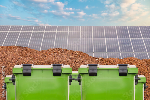 New green waste containers in front of biomass and a large solar panel farm