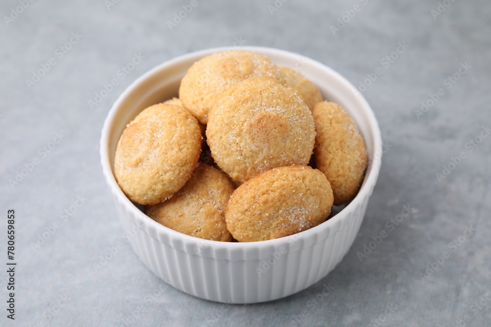 Tasty sugar cookies in bowl on grey table Tasty sugar cookies in bowl on grey table