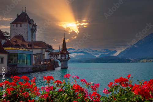 Oberhofen castle on Lake Thun in the Alps mountains, Canton Bern, Switzerland photo