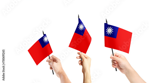 A group of people are holding small flags of Taiwan in their hands.